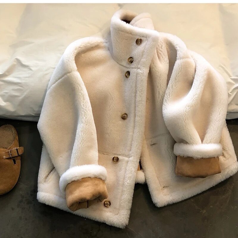 Winter luxury: faux leather shearling coat lined with real sheepskin. Double sided. for maximum warmth and style. Handmade